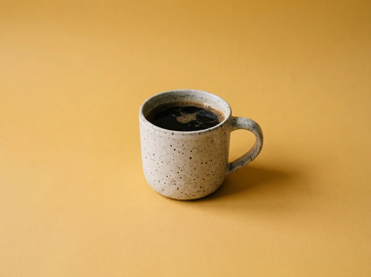 Nano Banana 2 Edit output: Change the backdrop to mustard yellow and keep the mug the same