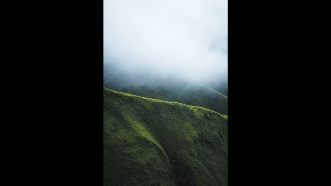 Mountain landscape image with fit contain, showing letterboxing to preserve aspect ratio